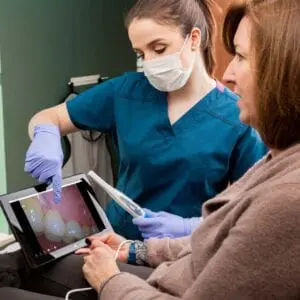 Dentists analyzing dental photographs